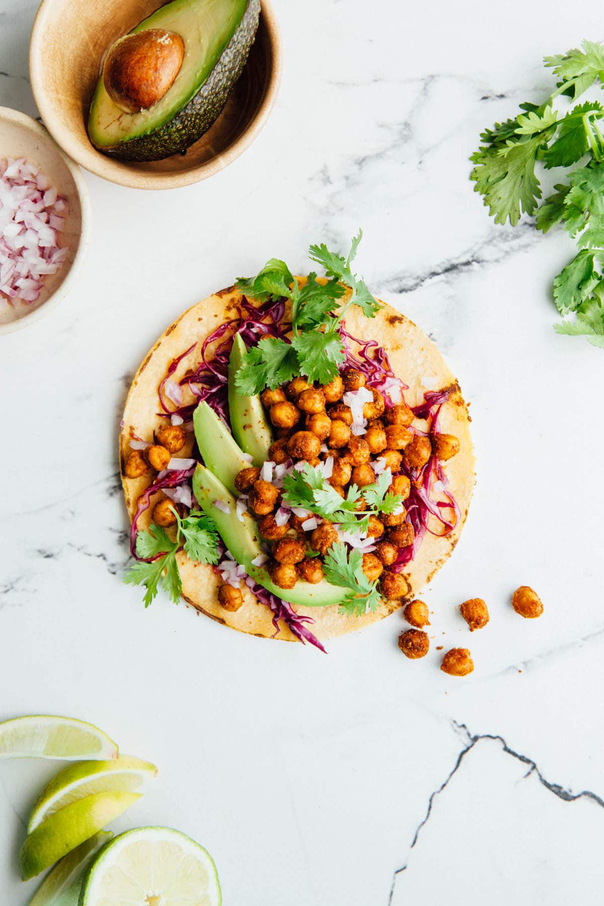 A single roasted chickpea taco laying flat and shot from overhead.