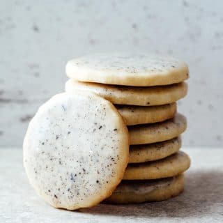 A stack of lavender sugar cookies with Earl Grey glaze.