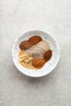 Chai spices in a bowl unmixed.