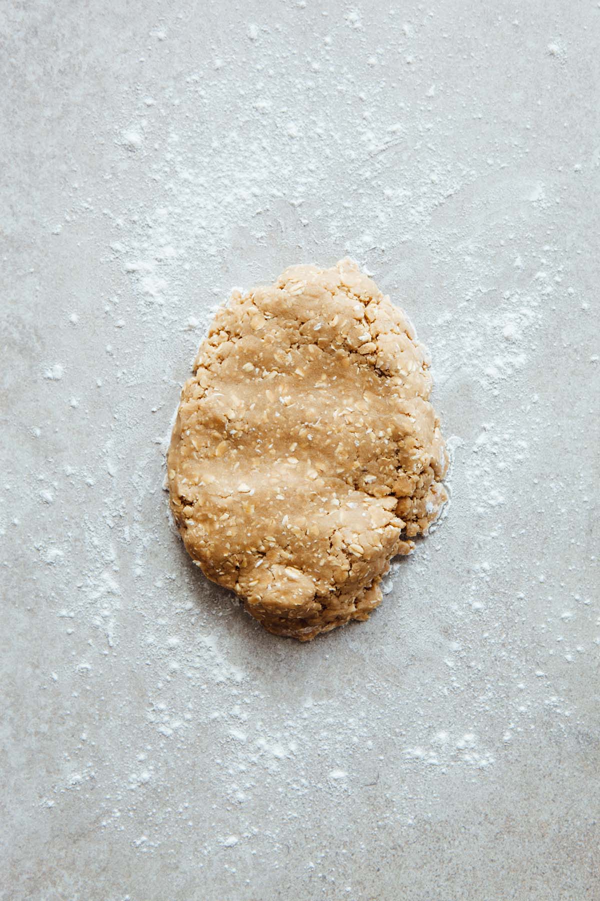 Cookie dough on a floured work surface.