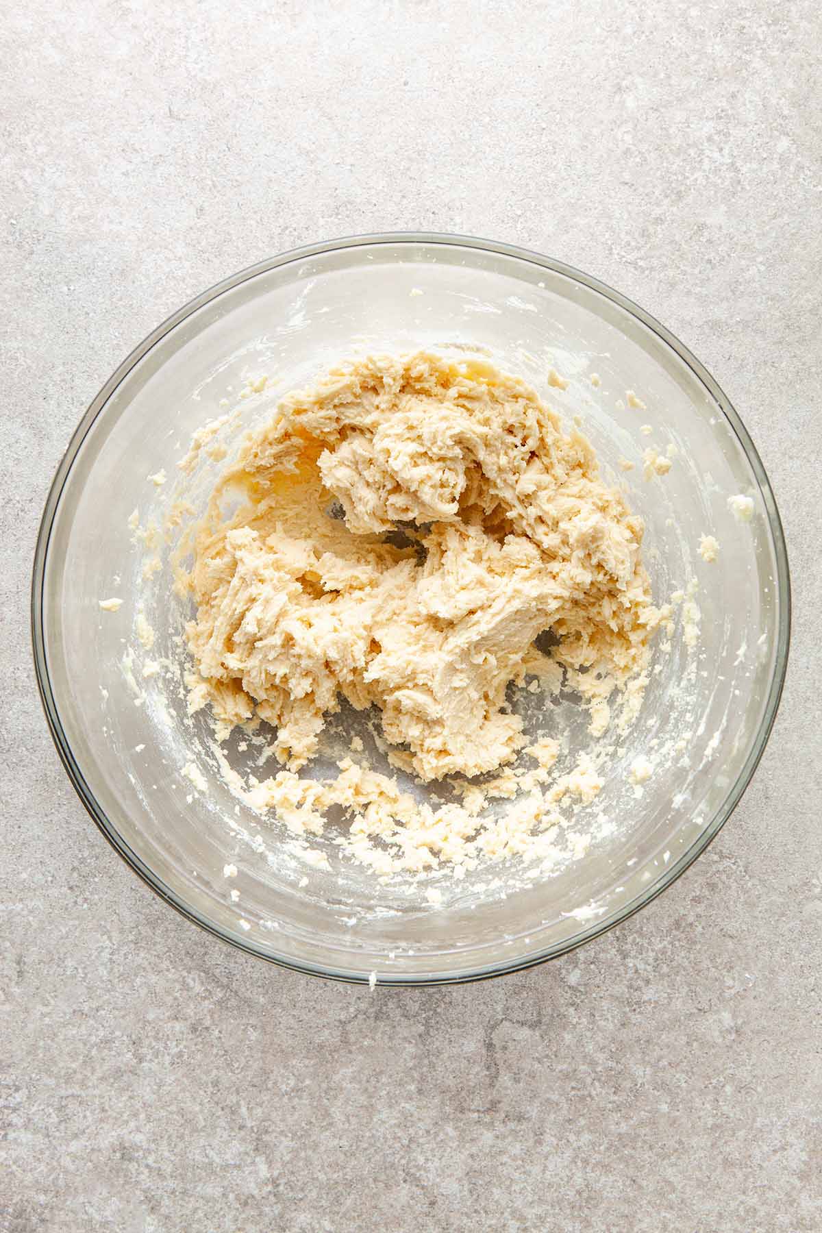 A glass bowl of cookie dough.