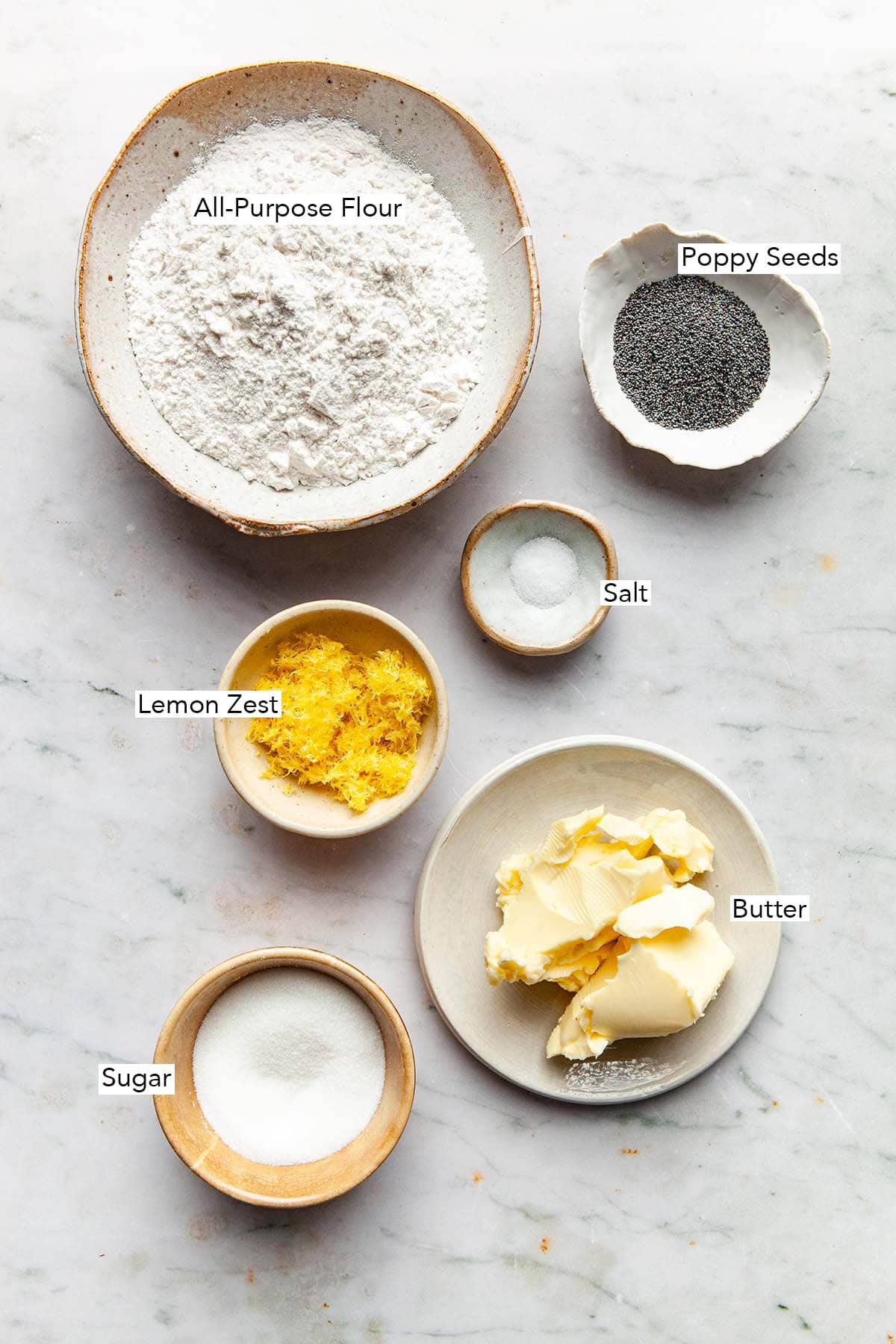 Ingredients to make lemon poppy seed shortbread cookies.