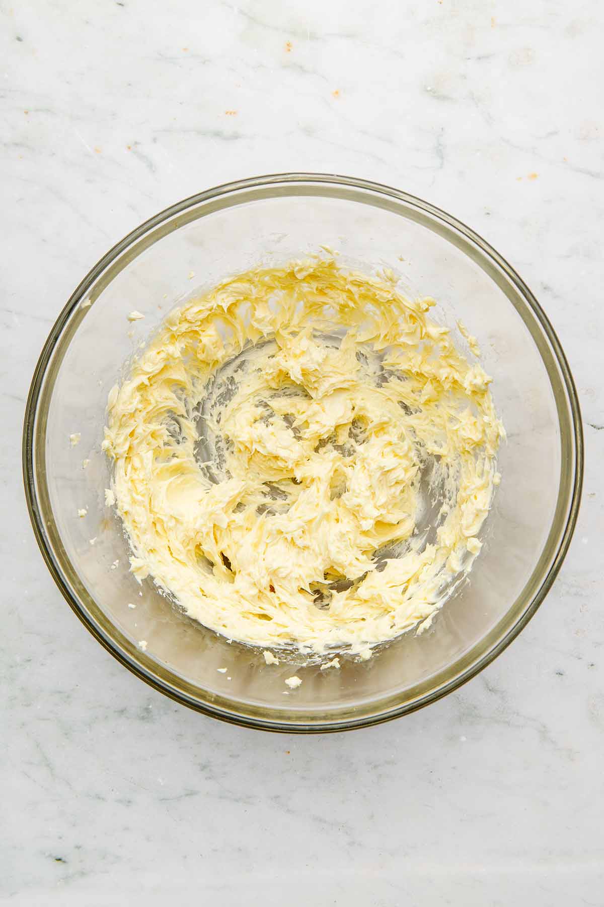 Whipped butter in a large glass bowl.