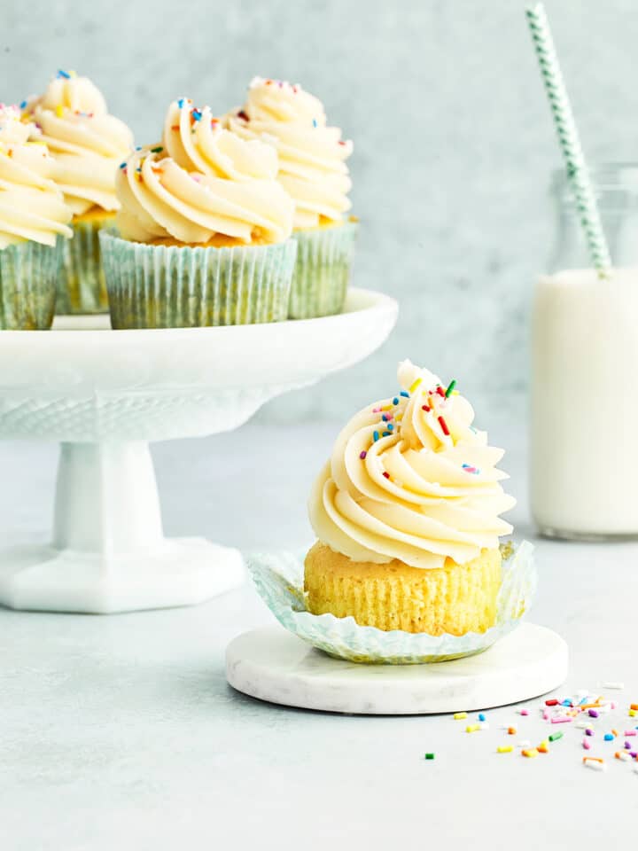 Cupcakes topped with vanilla buttercream and sprinkles.