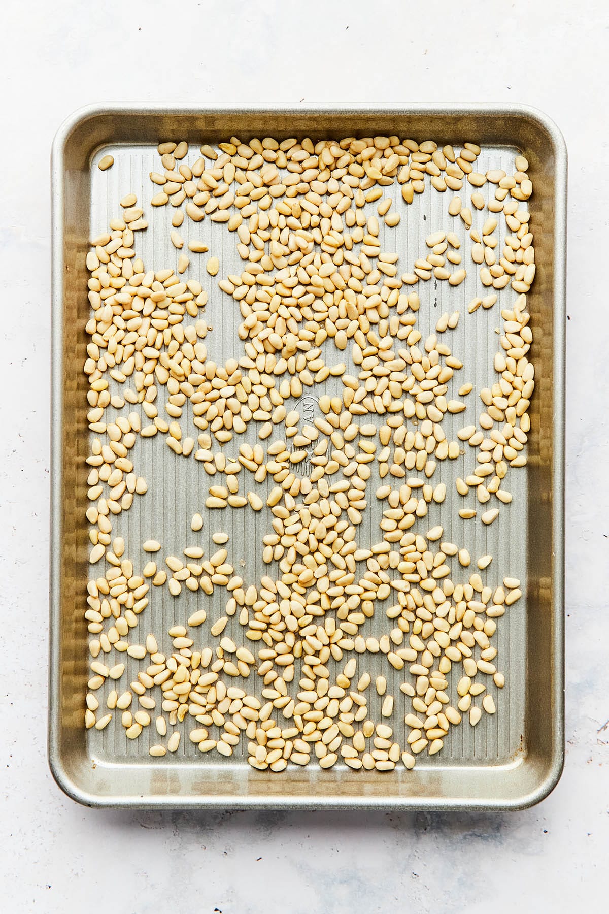 A tray of raw pine nuts.