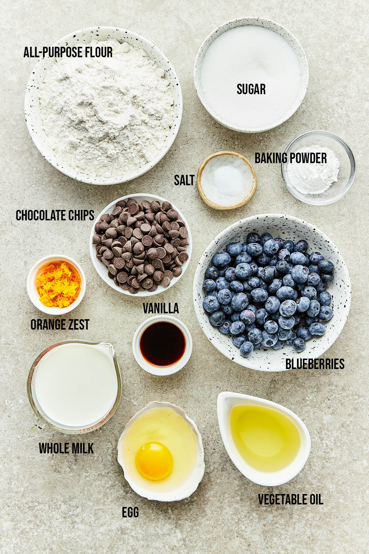 Ingredients to make blueberry chocolate chip muffins.