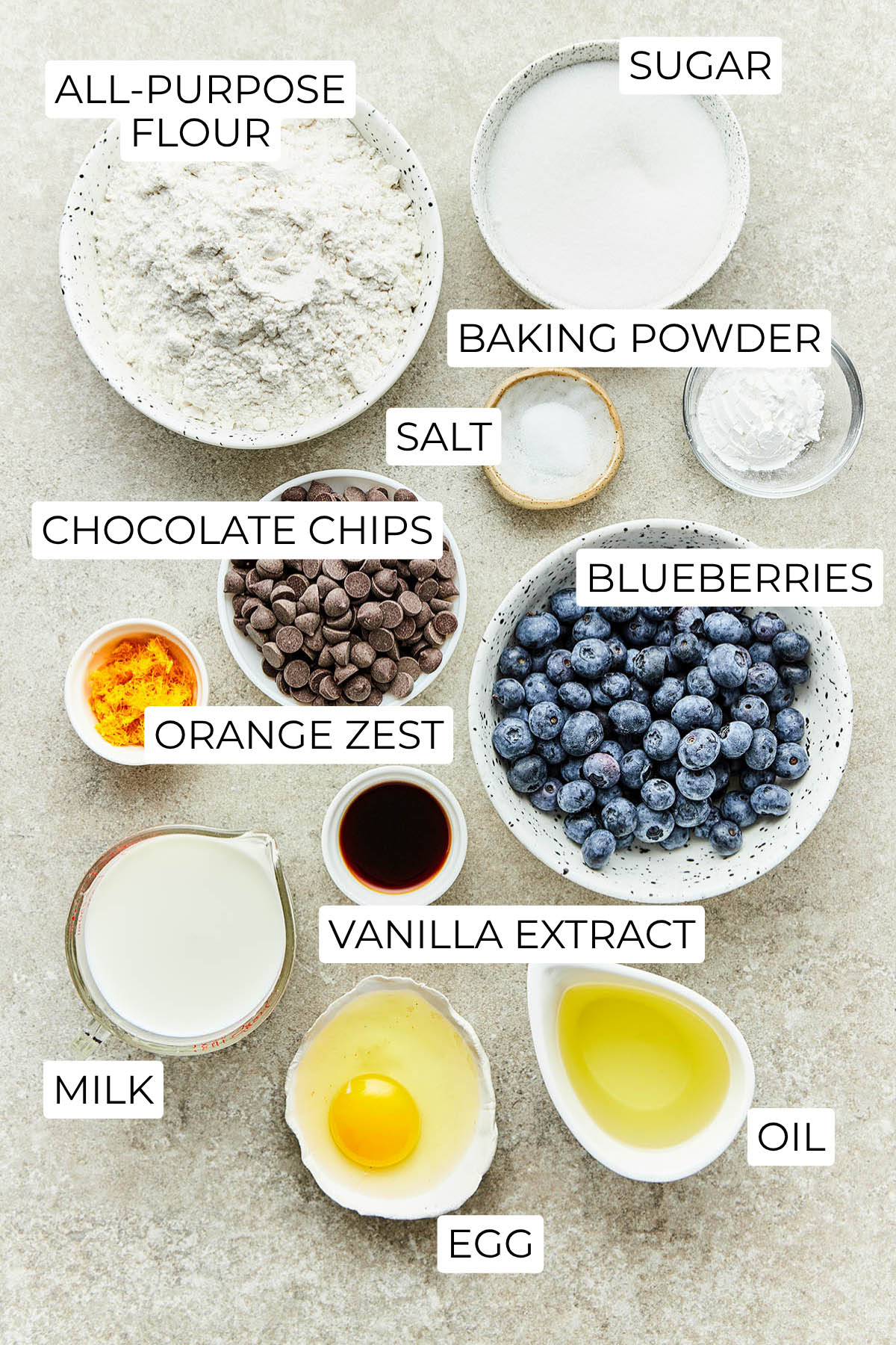 Ingredients to make blueberry chocolate chip muffins.