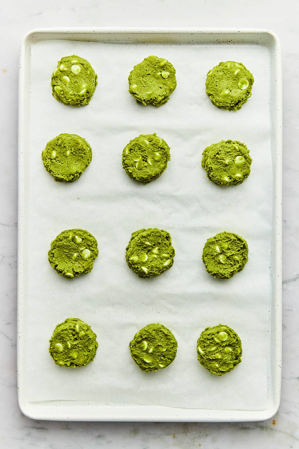 Slightly flattened green tea cookies about to go in the oven.