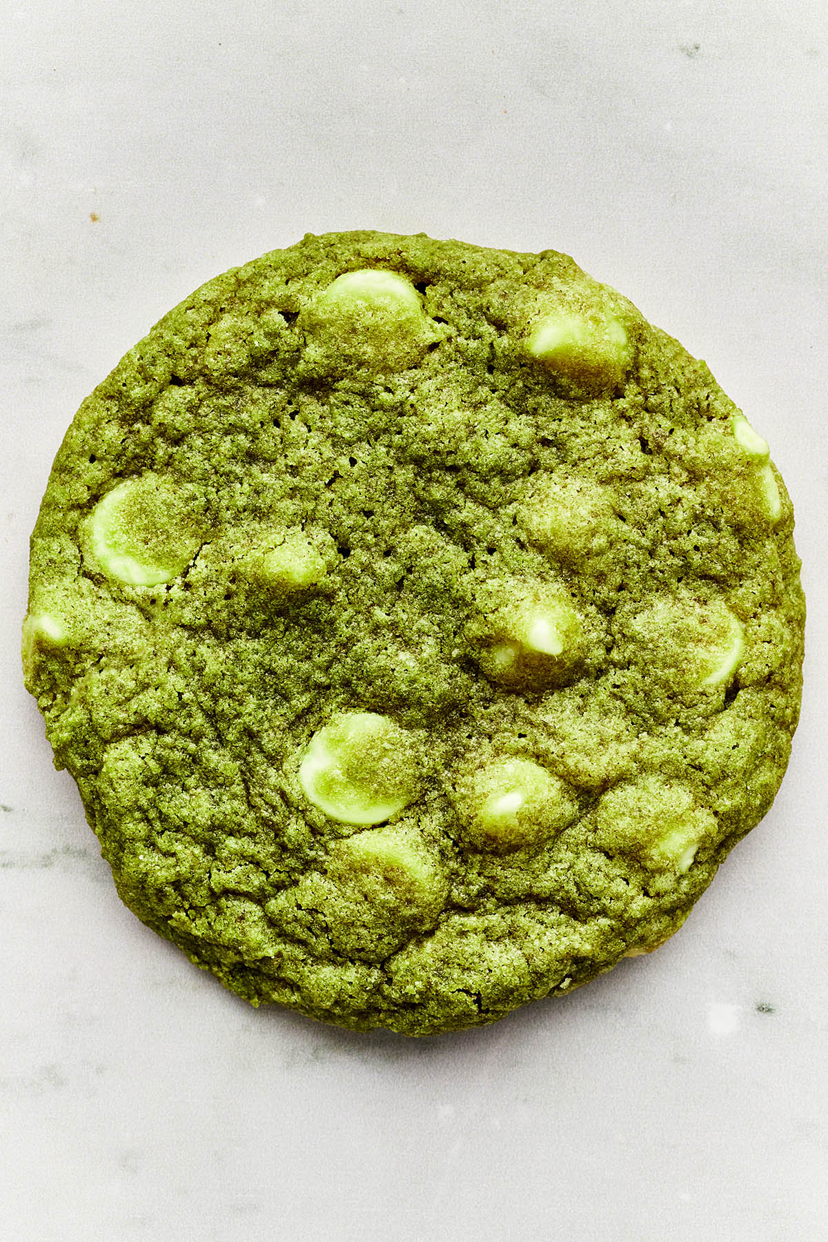 Close up overhead full frame image of one green tea cookie.