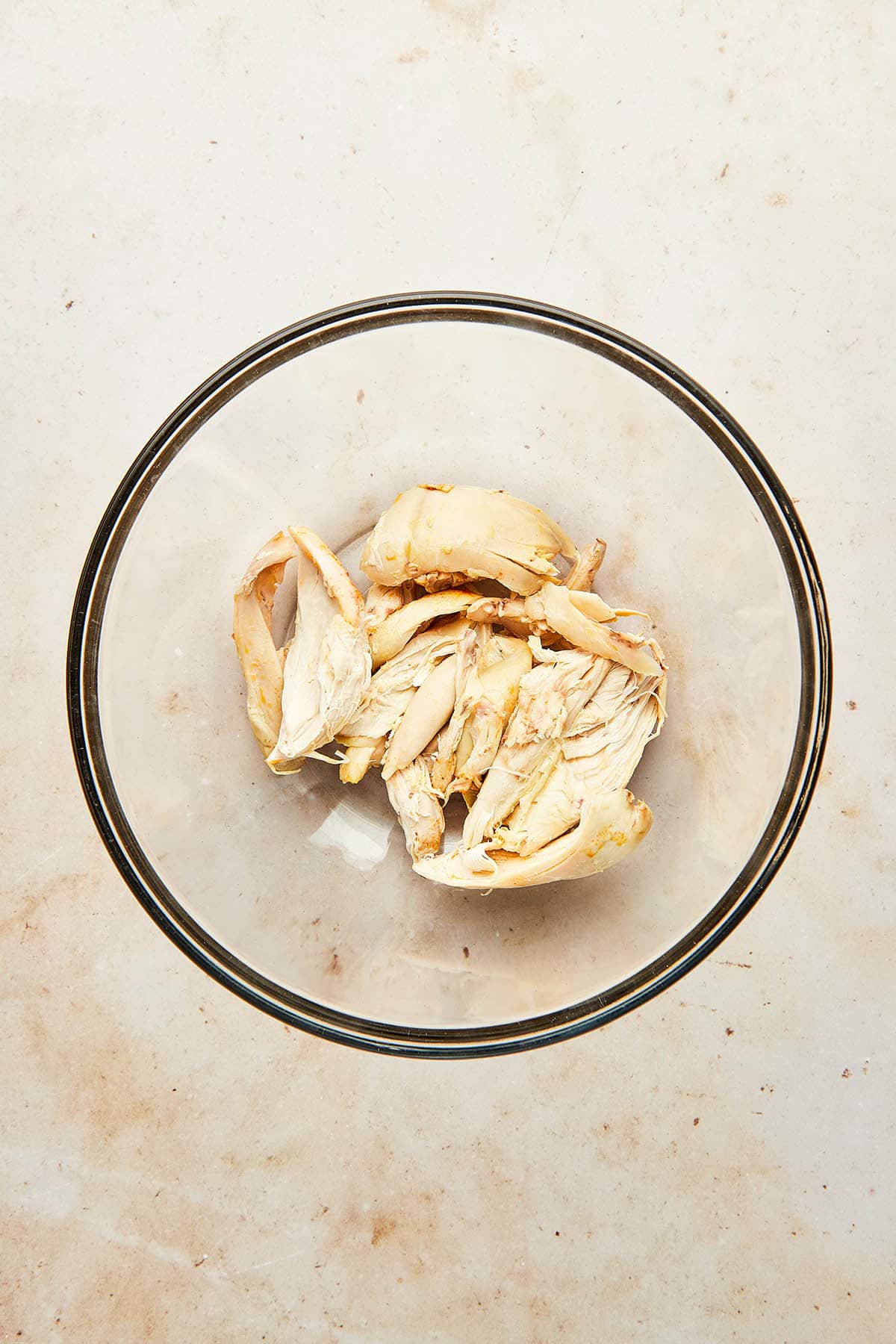 A bowl of pulled rotisserie chicken.