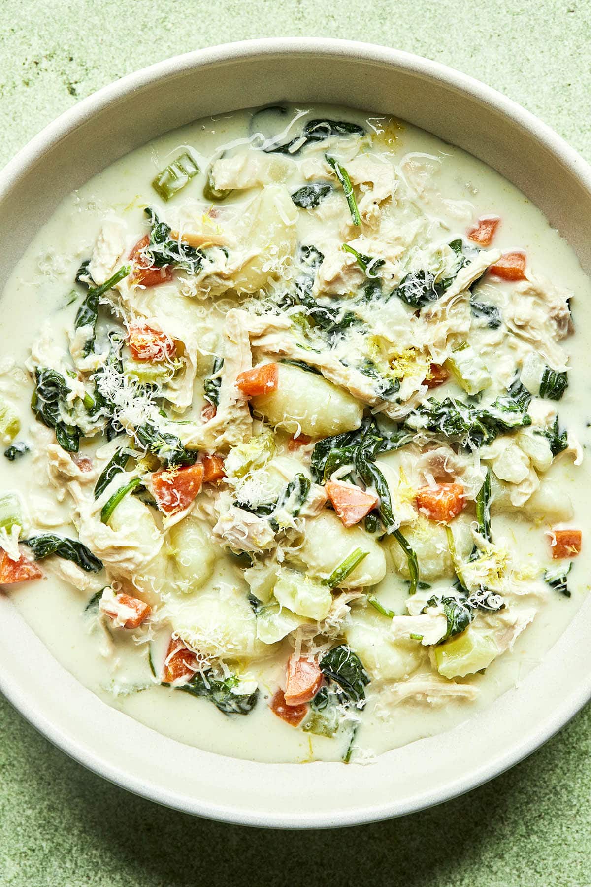 A bowl of chicken Florentine soup.