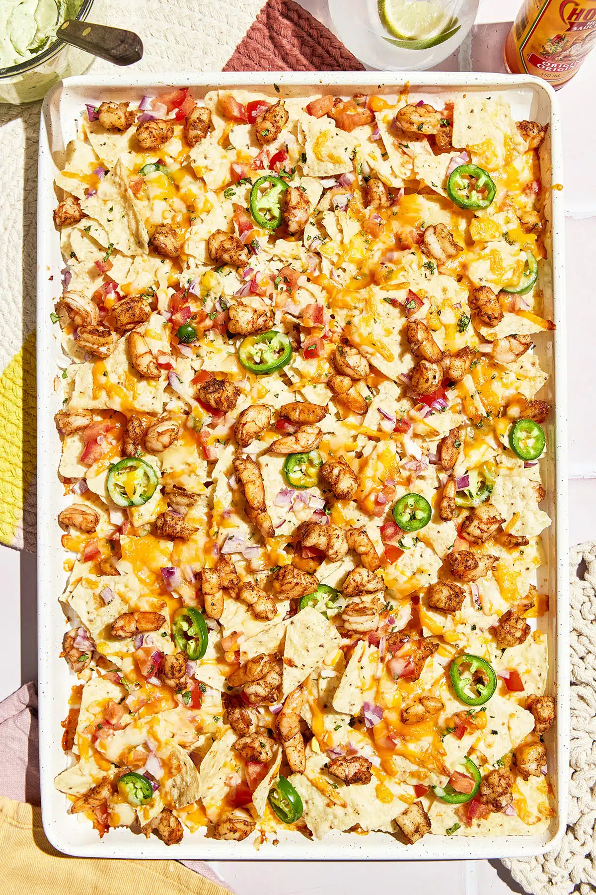 shrimp nachos loaded melted cheese jalapeños pico de gallo guacamole sour cream Mexican-inspired game day appetizer party