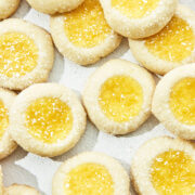 Close up of lemon curd-filled thumbprint cookies, top down in hard light.