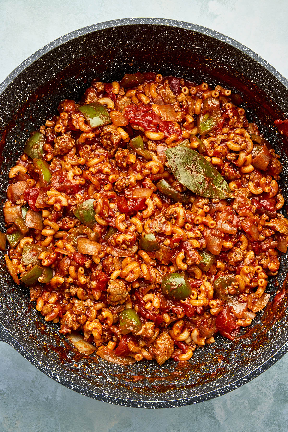 A pot of cooked sausage goulash.