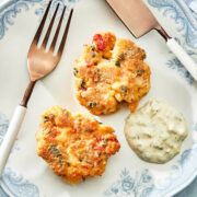 A plate with two lobster cakes.