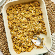 A baking dish of potato stuffing (mashed potato dressing with summer savory).