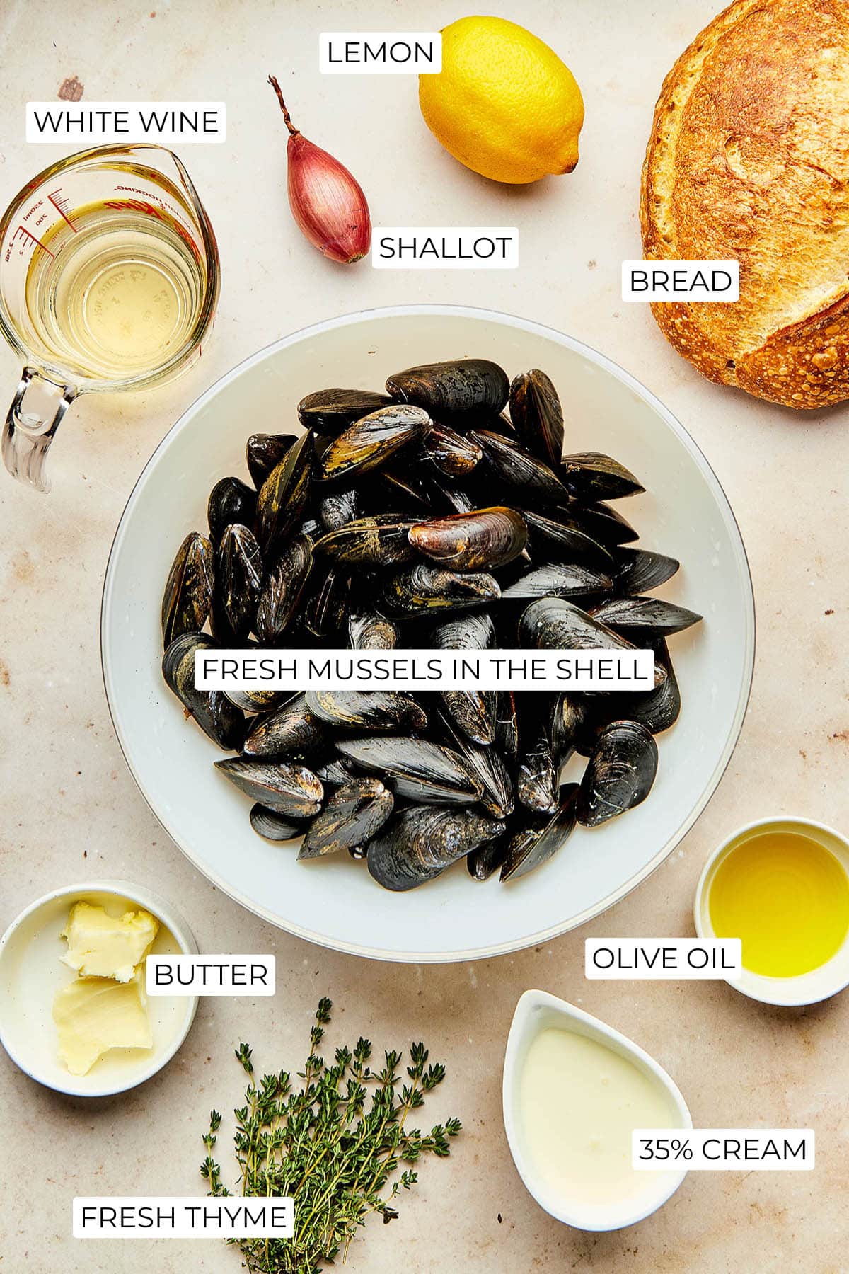 Ingredients to make mussels in lemon cream broth on toast.