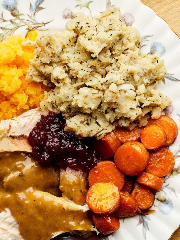 A plate of turkey dinner with potato stuffing, also called potato dressing.